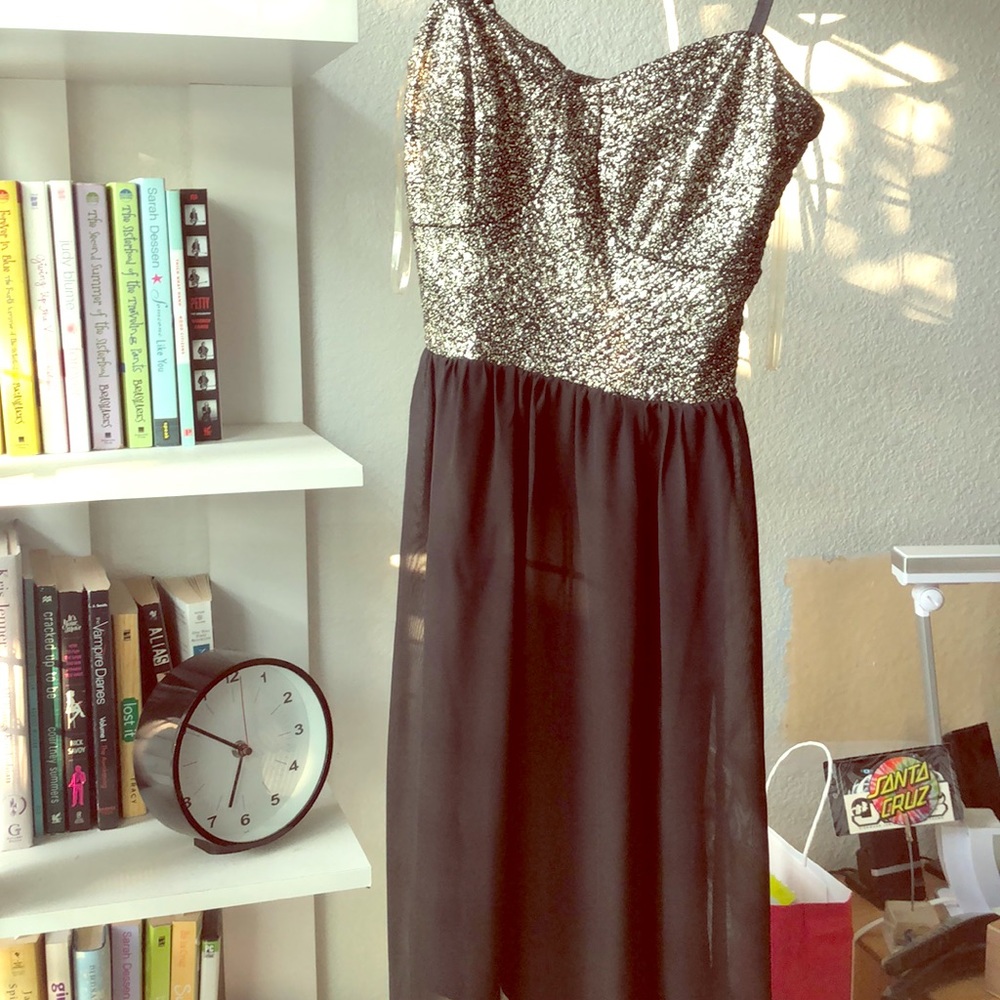 A long black dress with a slit cut on each side